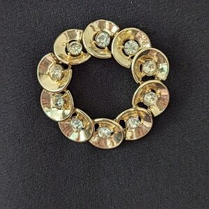 Corocraft rare Pat.pending gold tone brooch with faux diamonds rhinestone circle
